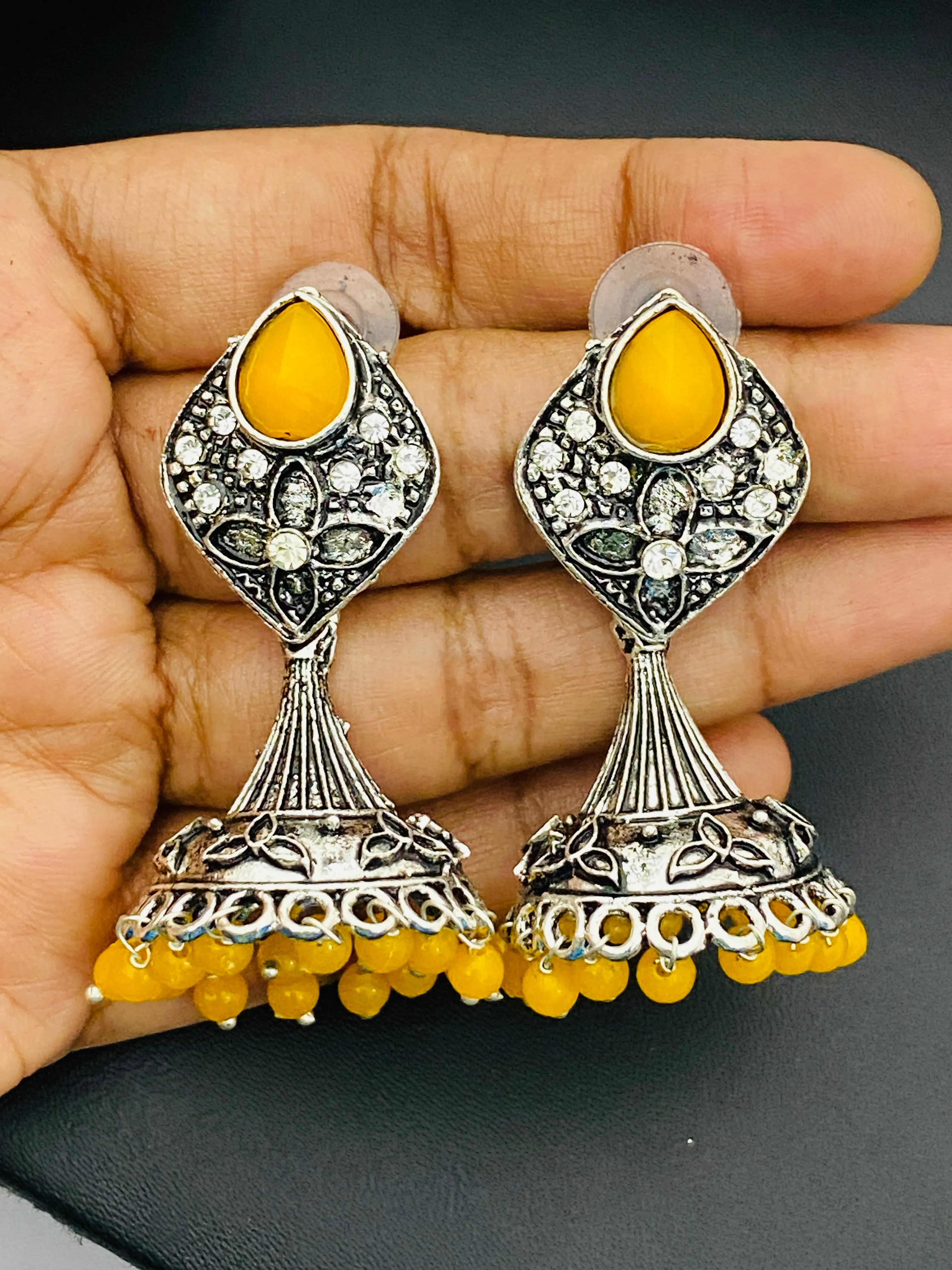 Elegant Yellow Color Stone Beaded Flower Designer Silver Toned Oxidized Jhumka Earrings With Beads